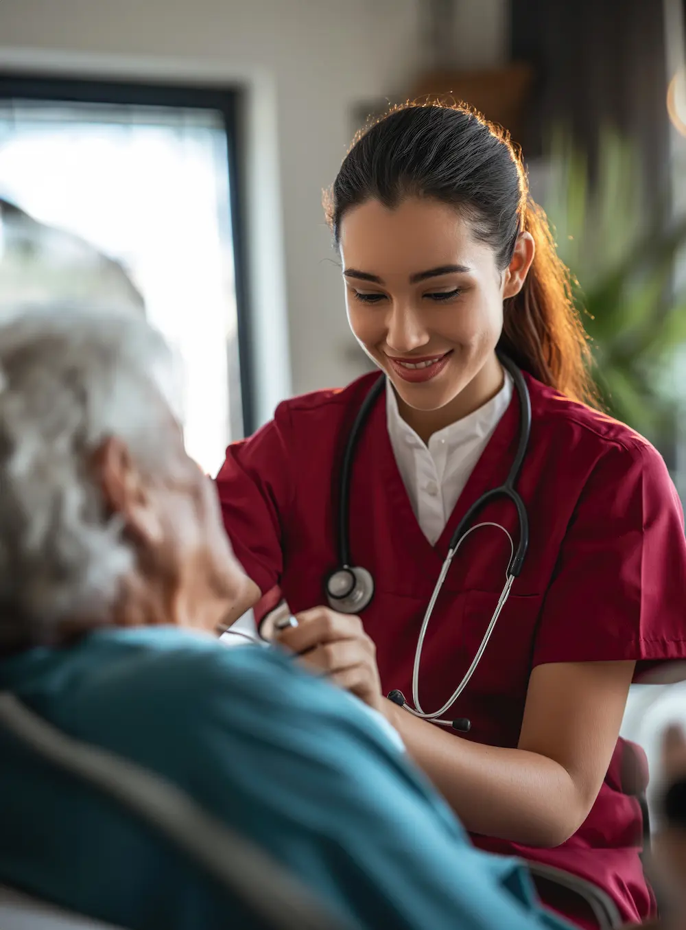 Elderly woman smiling with caregiver