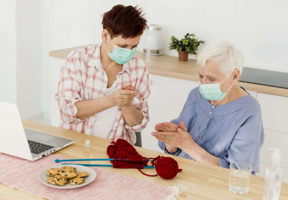 Caregiver enjoying conversation with elderly man
