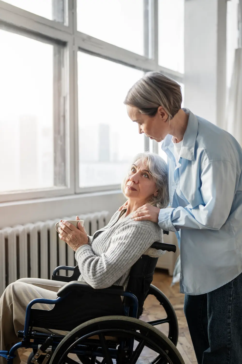 Caregiver with a woman on a wheelchair