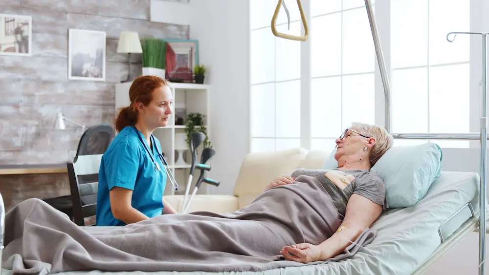 Caregiver providing end-of-life comfort