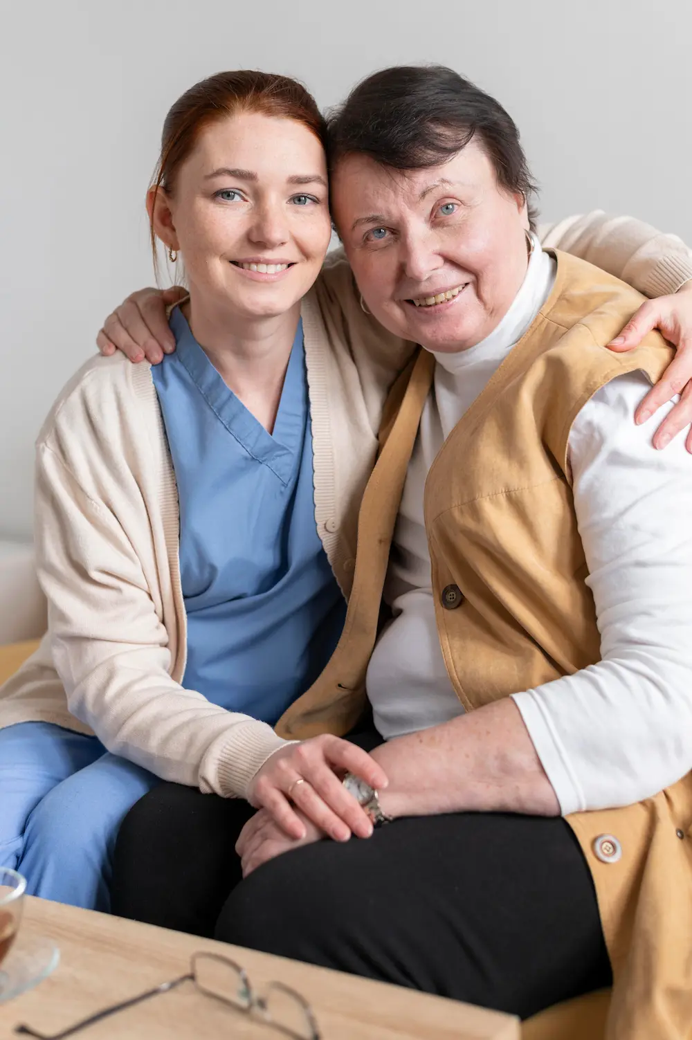 Caregiver smiling with an elderly person