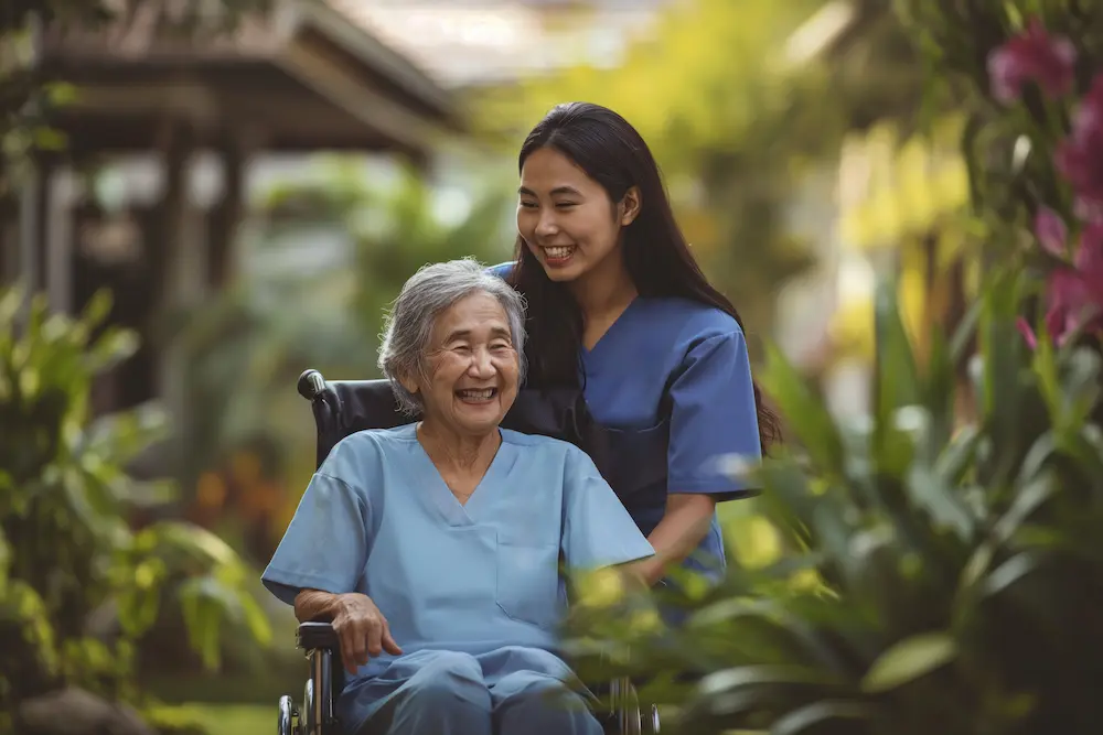 Elderly woman smiling with caregiver among nature